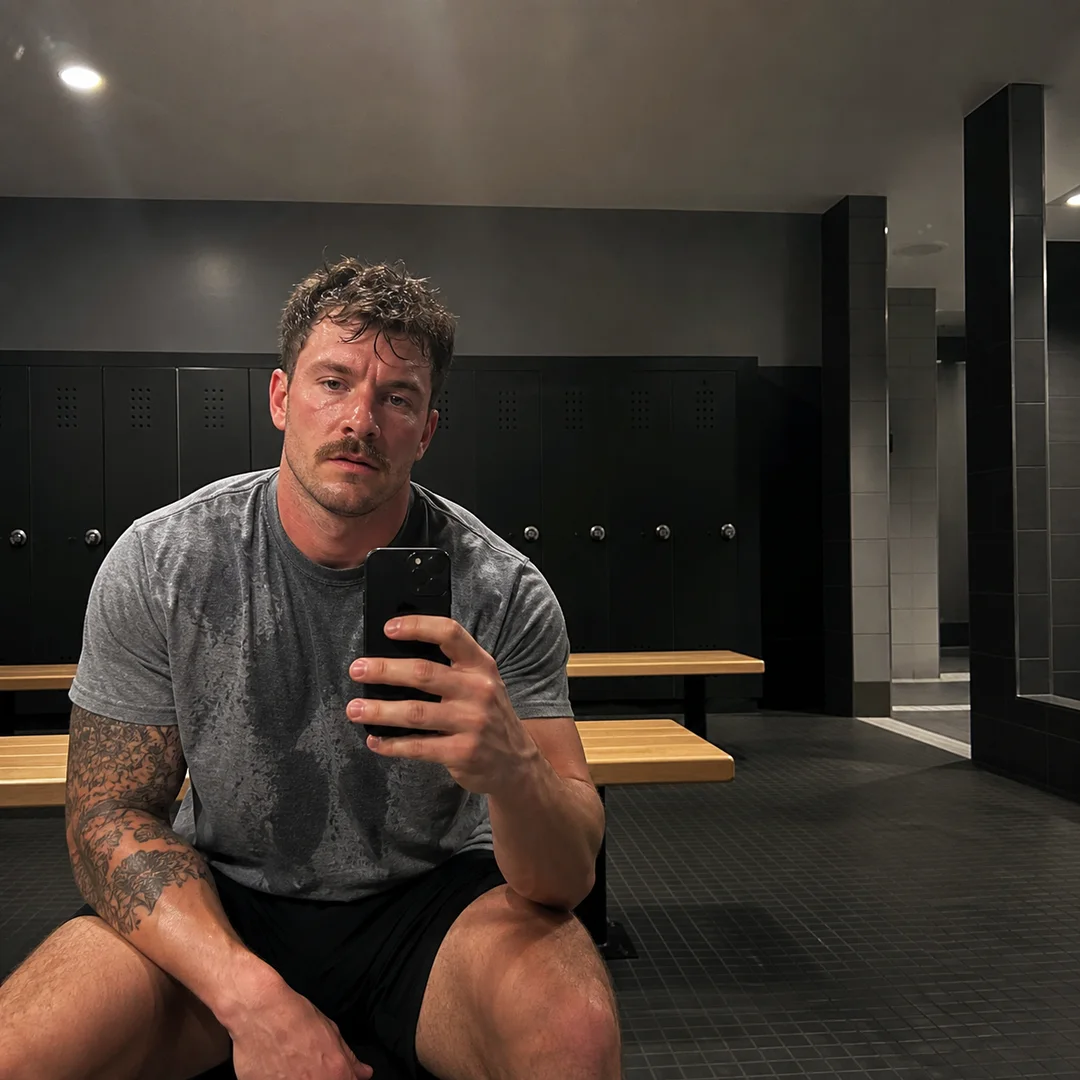 Candid post-workout mirror selfie opening a personal fitness claim.