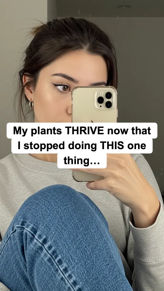 Slideshow slide: mirror selfie with the hook text 'My plants THRIVE now that I stopped doing THIS one thing…'