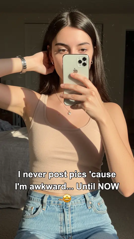 Slideshow slide: mirror selfie with the hook text 'I never post pics 'cause I'm awkward… Until NOW'